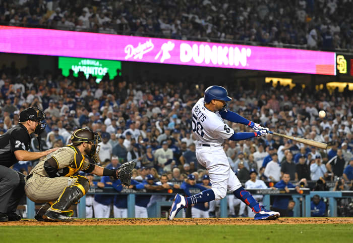 Mookie Betts connects with a pitch during a game for the Dodgers.